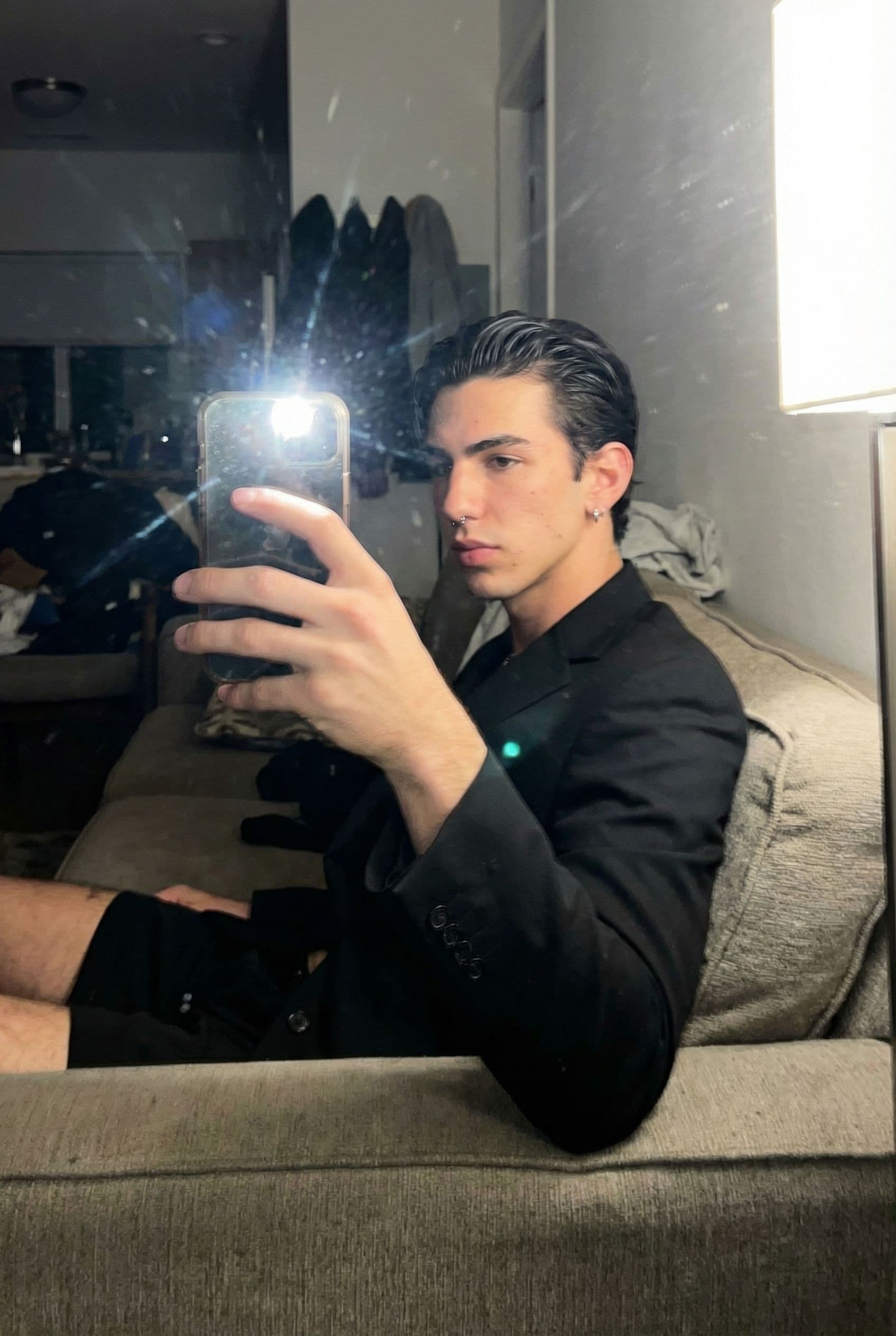 AI generated: An extremely ordinary iPhone mirror selfie photo with no clear subject or framing—just a casually ta...
