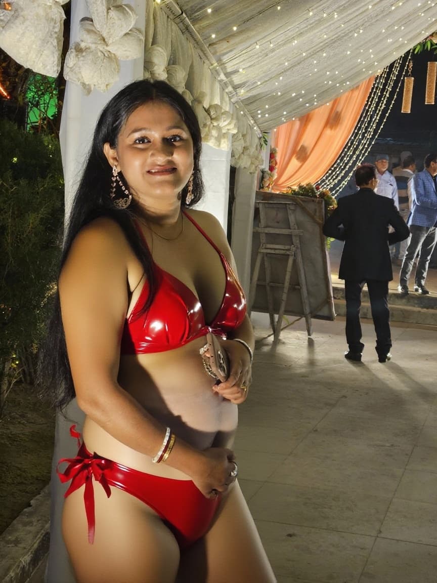 AI generated: Keep the body intact and make her wear a red latex bikini....make her boobs the same size but poping...