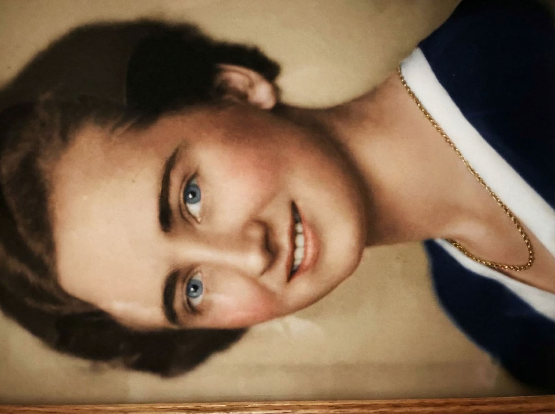 AI generated: color the picture of this german lady, blue eyes