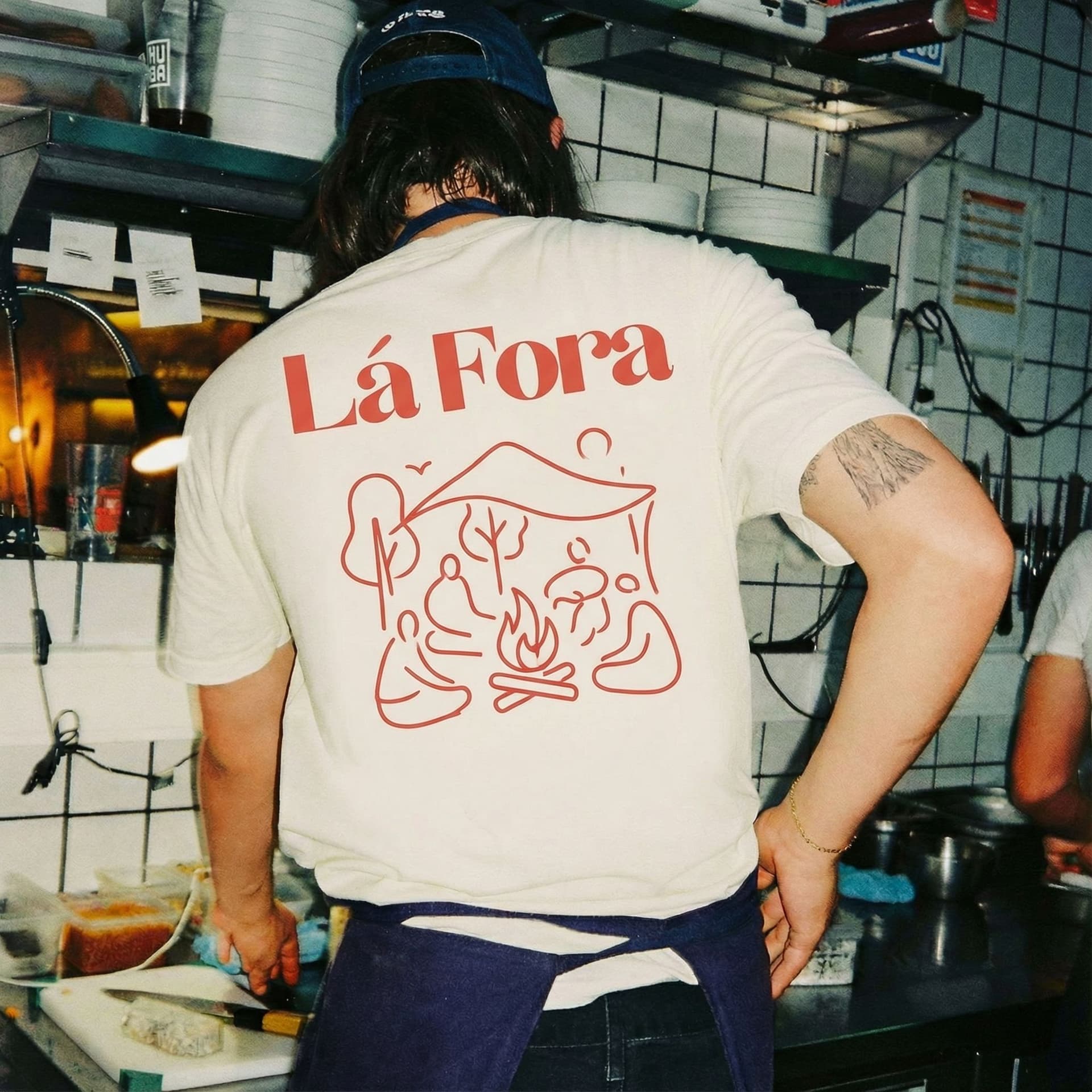 AI generated: Create a new design for this t-shirt in a similar style but with a motive for my company Láfora. Mak...