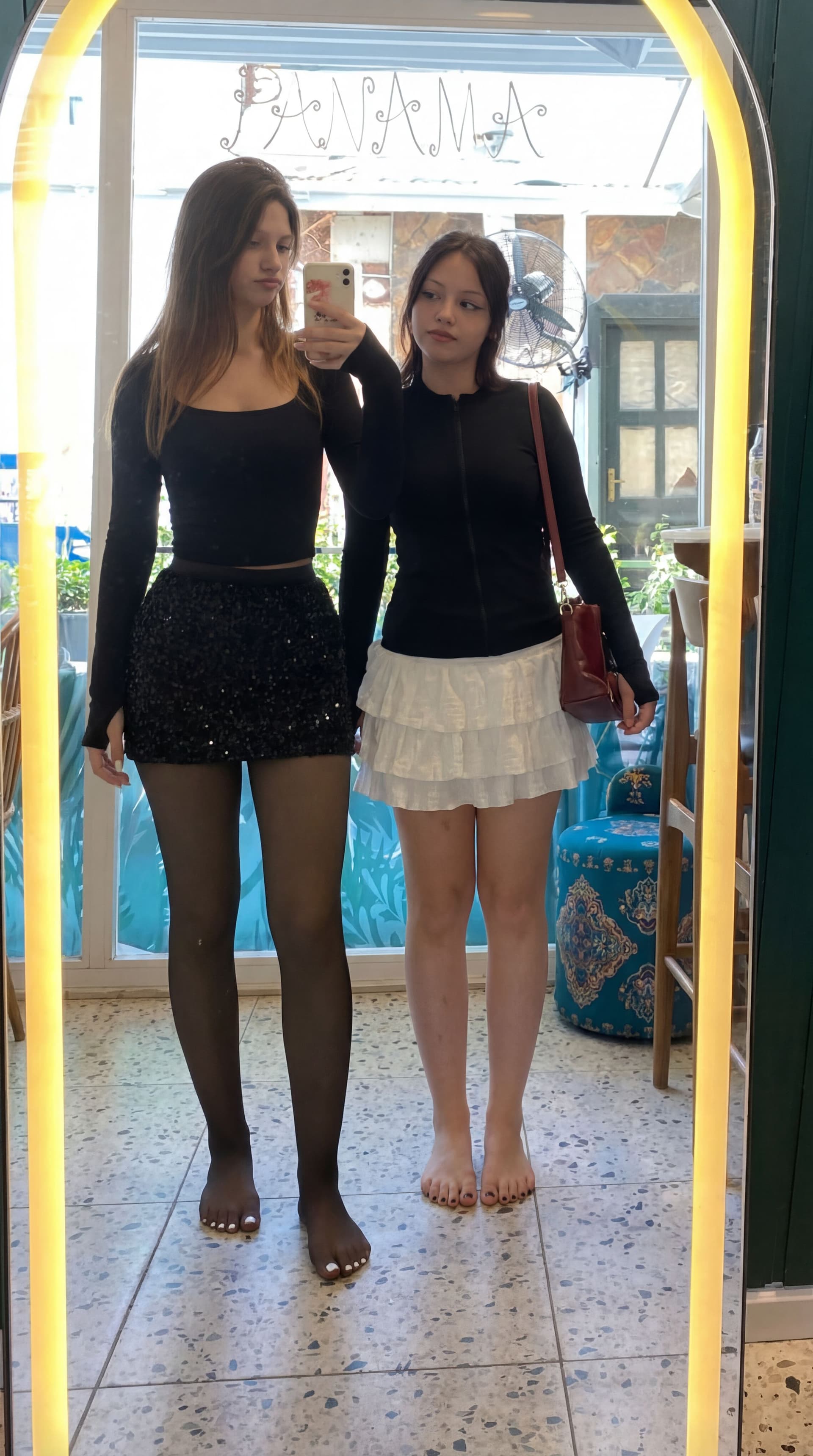 AI generated: barefoot both of them.
first girl white paint nails.
second girl black paint nails.