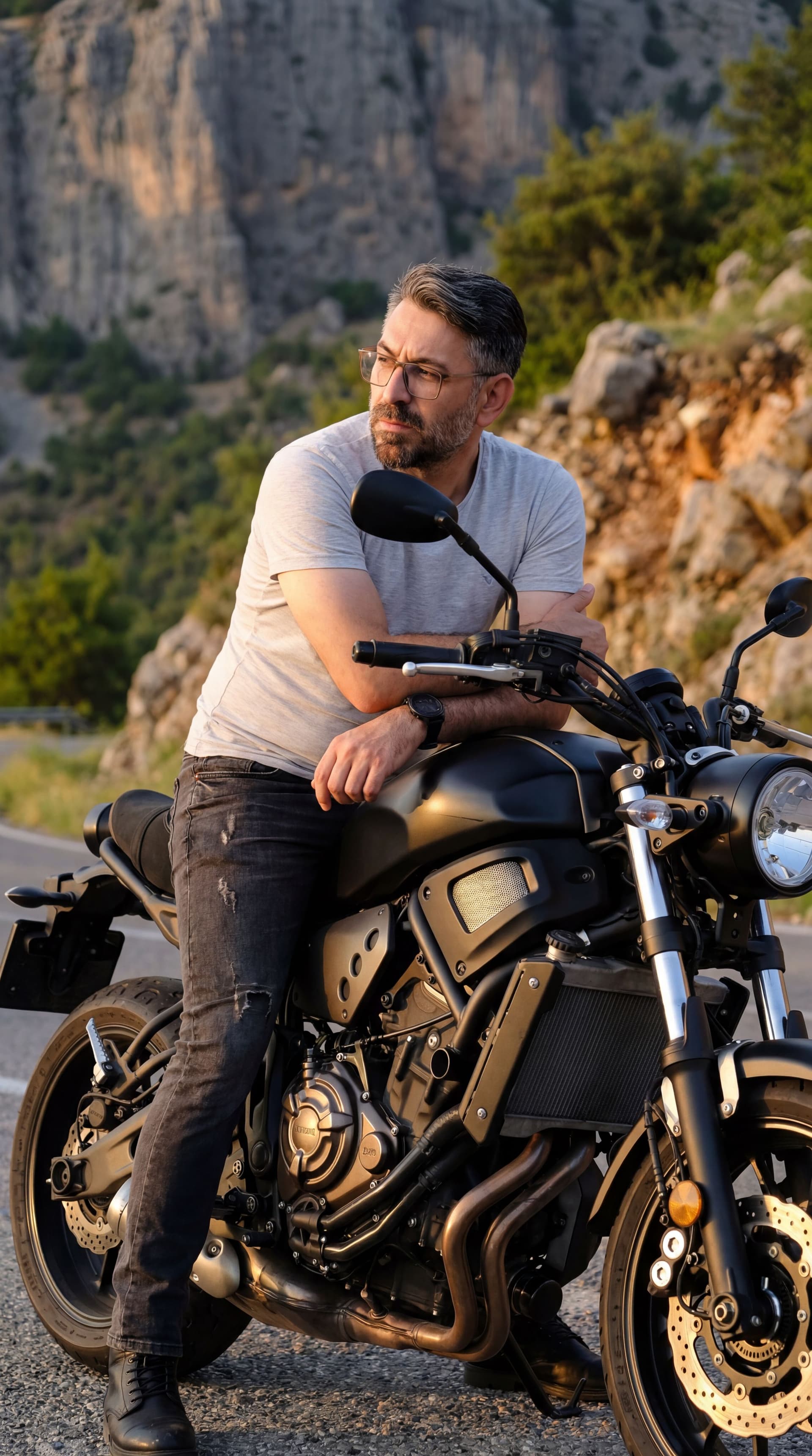 AI generated: I am leaning casually against my motorcycle, sitting slightly sideways on the seat with my legs apar...
