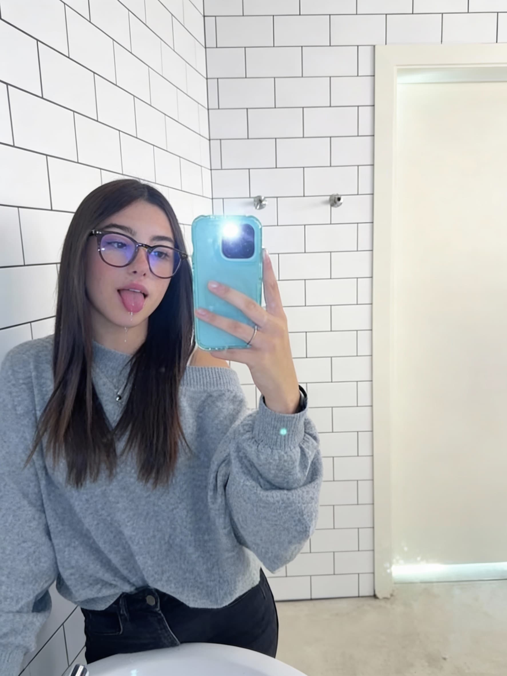 AI generated: the girl sticking out her tongue with saliva