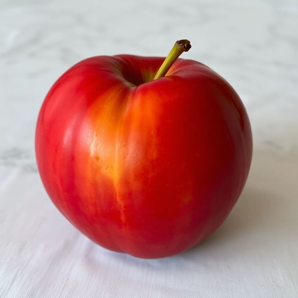 AI generated: une pomme rouge sur une table marron