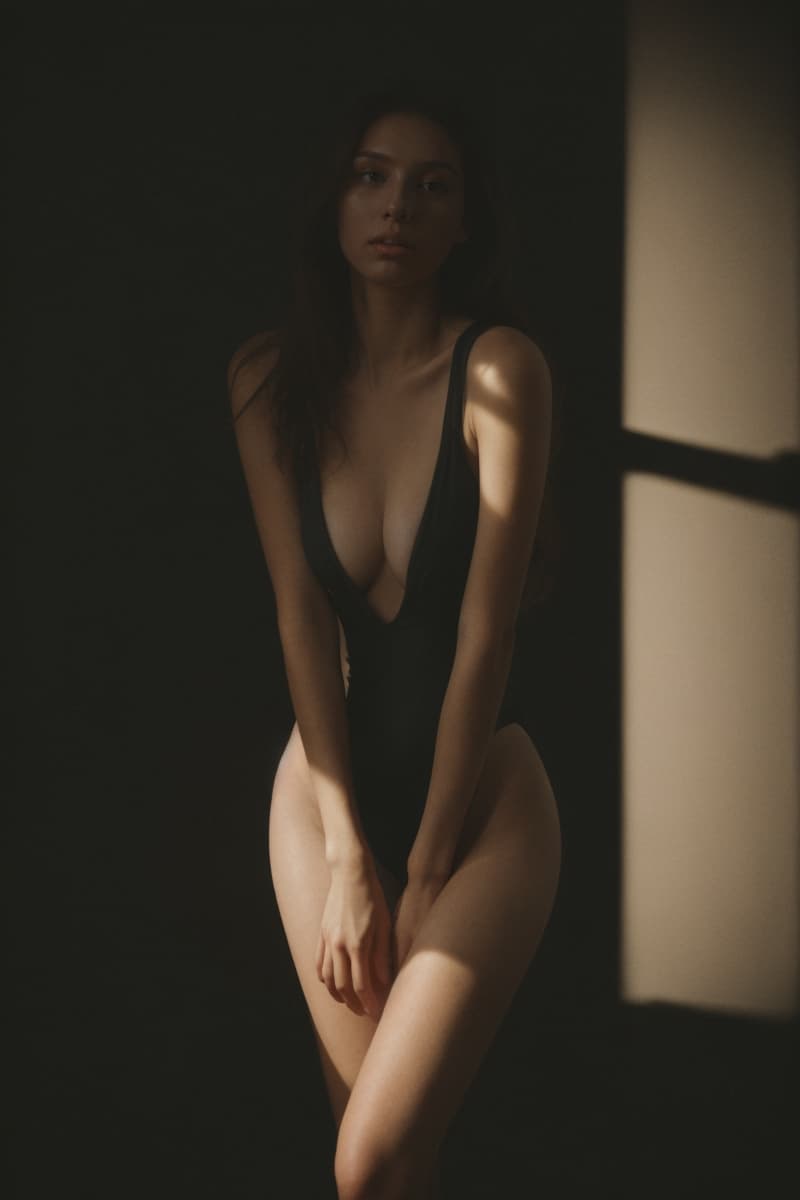 AI generated: full body visible of A young woman with long, wavy brown hair wears a black one-piece swimsuit and w...