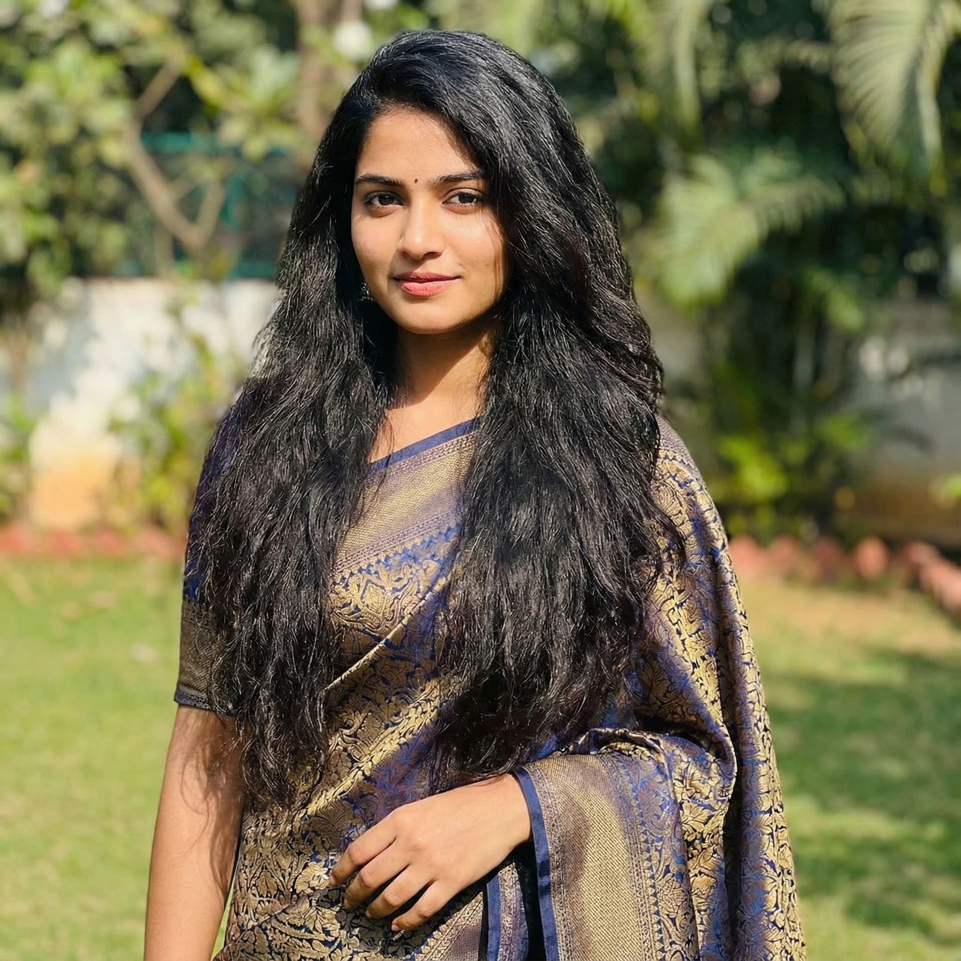 AI generated: a girl in saree with open hairs
