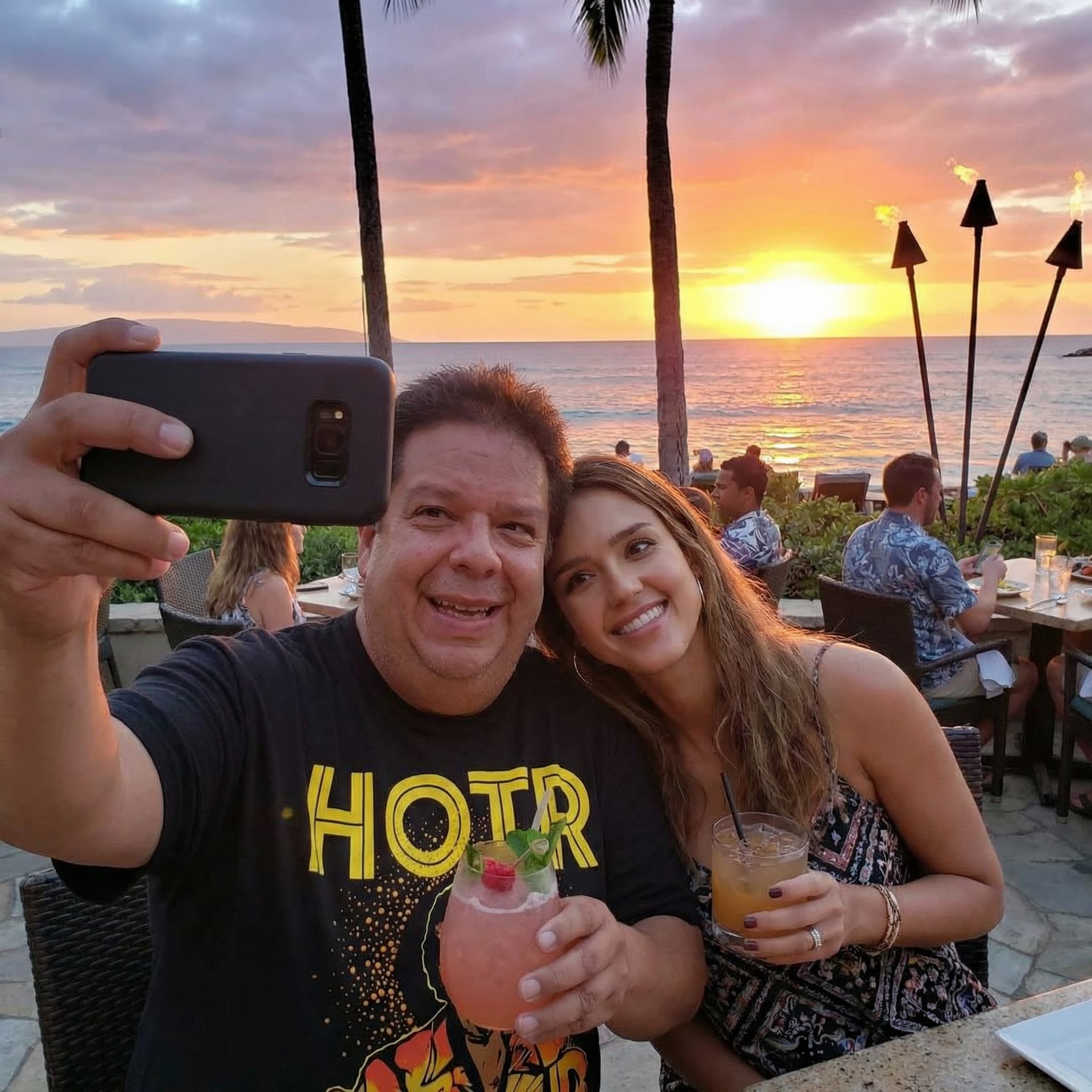 AI generated: Casual image with Jessica Alba at a sunset cocktail lounge in Maui.
