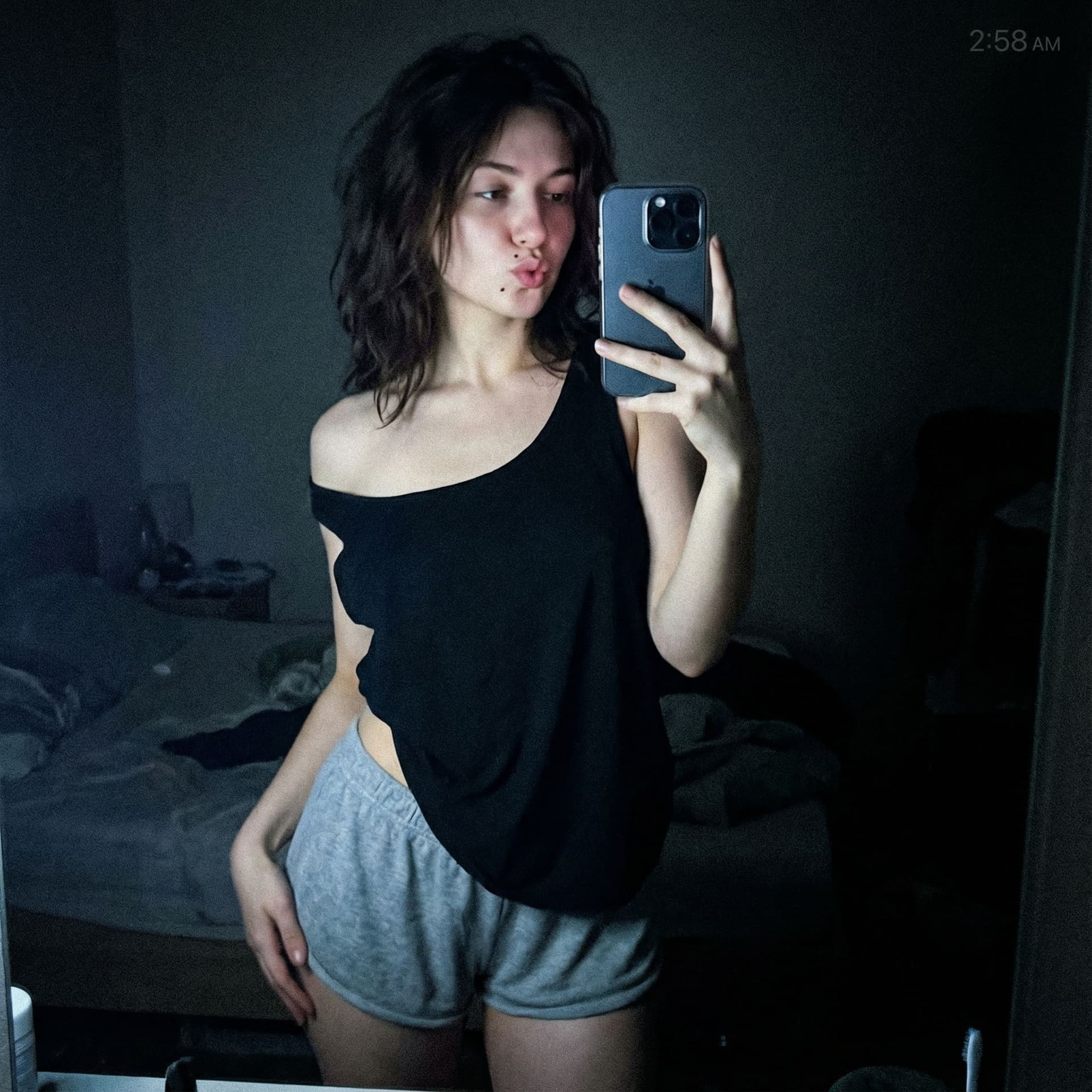 AI generated: Ultra-realistic full-body amateur selfie of “AVA-47”, skinny 22-year-old European brunette with mess...