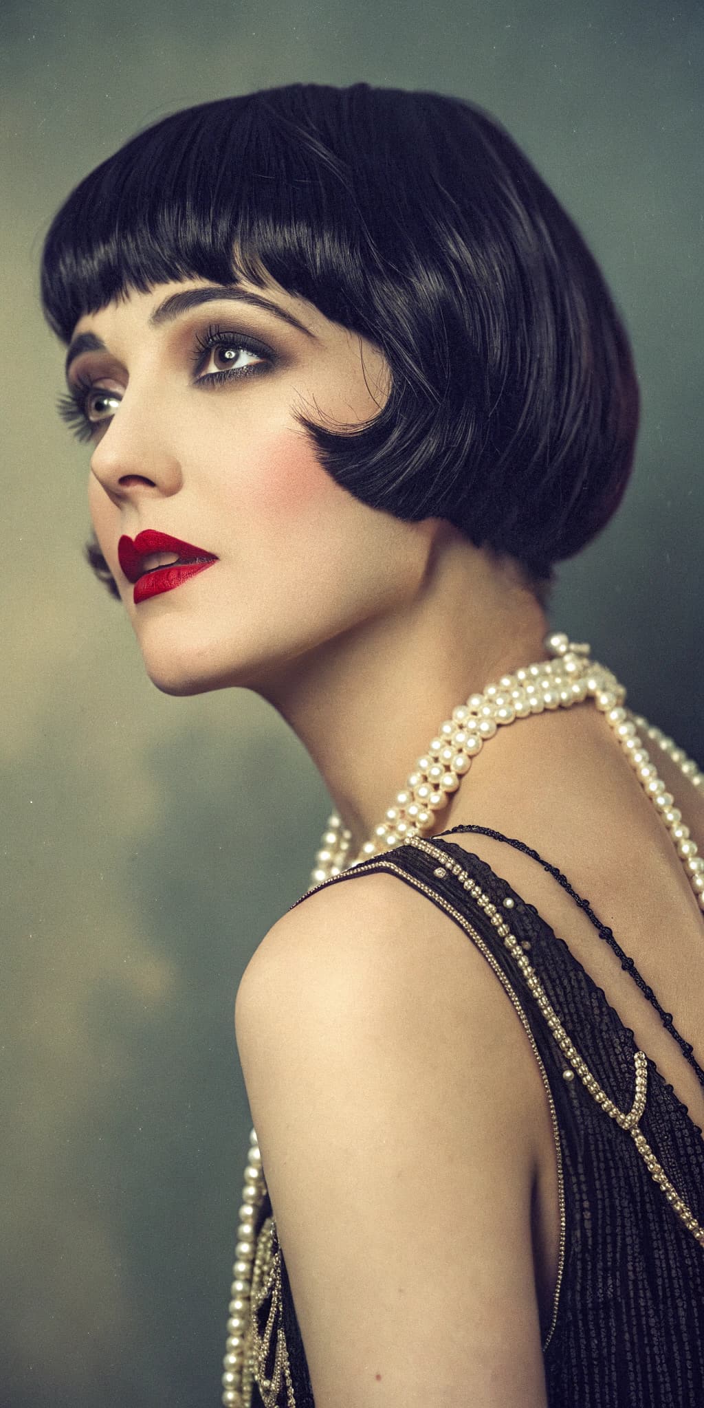 AI generated: analog color film photograph of a 1920s flapper girl, luxurious, opulence, short black hair, red lip...