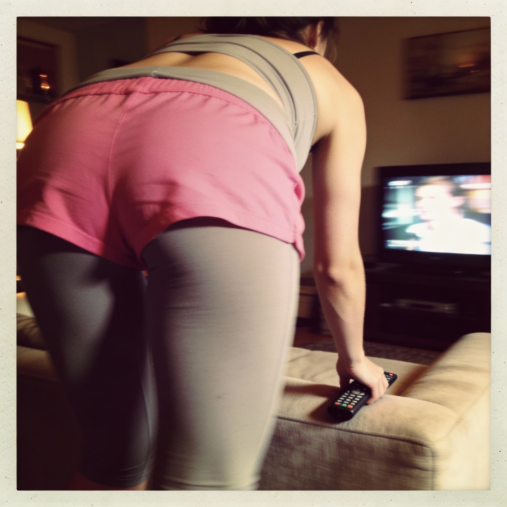 AI generated: Ultra photorealistic 2010s iPhone snapshot, she wears a pink gym crunch short. photo only shows her ...