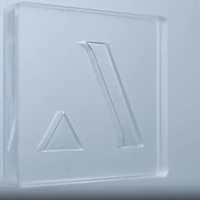 AI generated video: create a lateral dolly camera animation focusing only on the figure to the right of the triangle. Th...