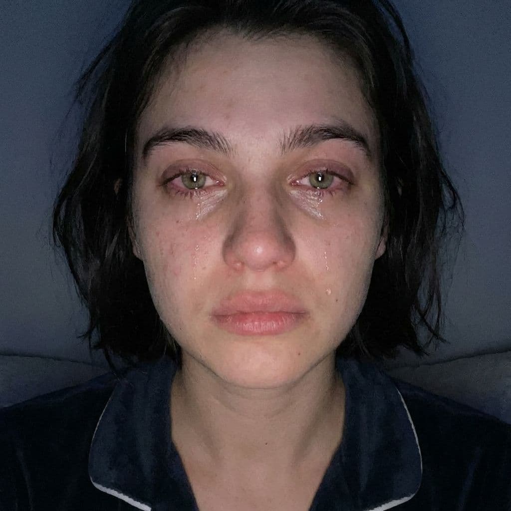 AI generated: A realistic close-up selfie shot of the same young woman from the reference image, captured front-fa...