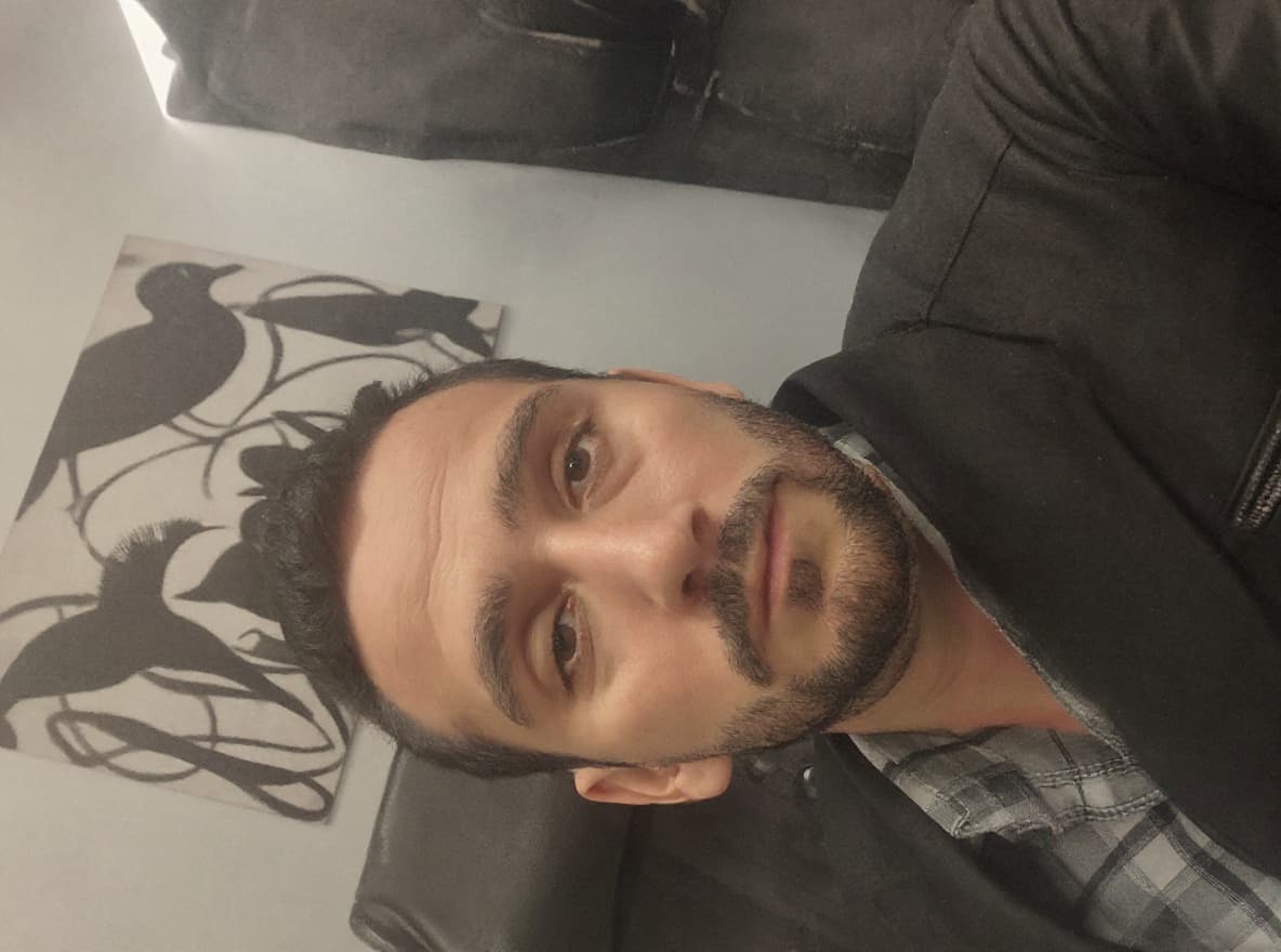 AI generated: 
Here's a detailed midjourney prompt based on the image you provided:

"Portrait of a man deeply foc...