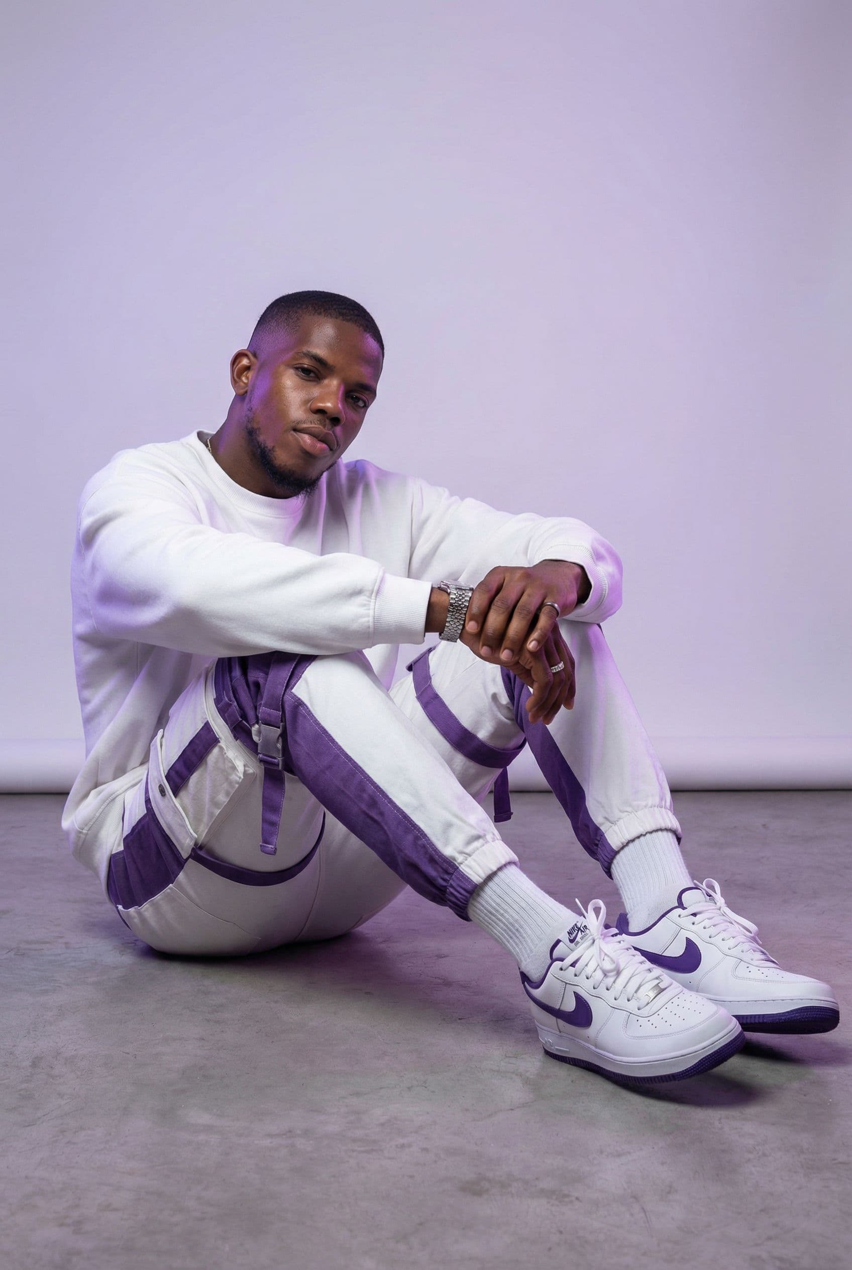 AI generated: Oversized white sweatshirt, white purple oversized combat jean, styled with footwear: white purple n...
