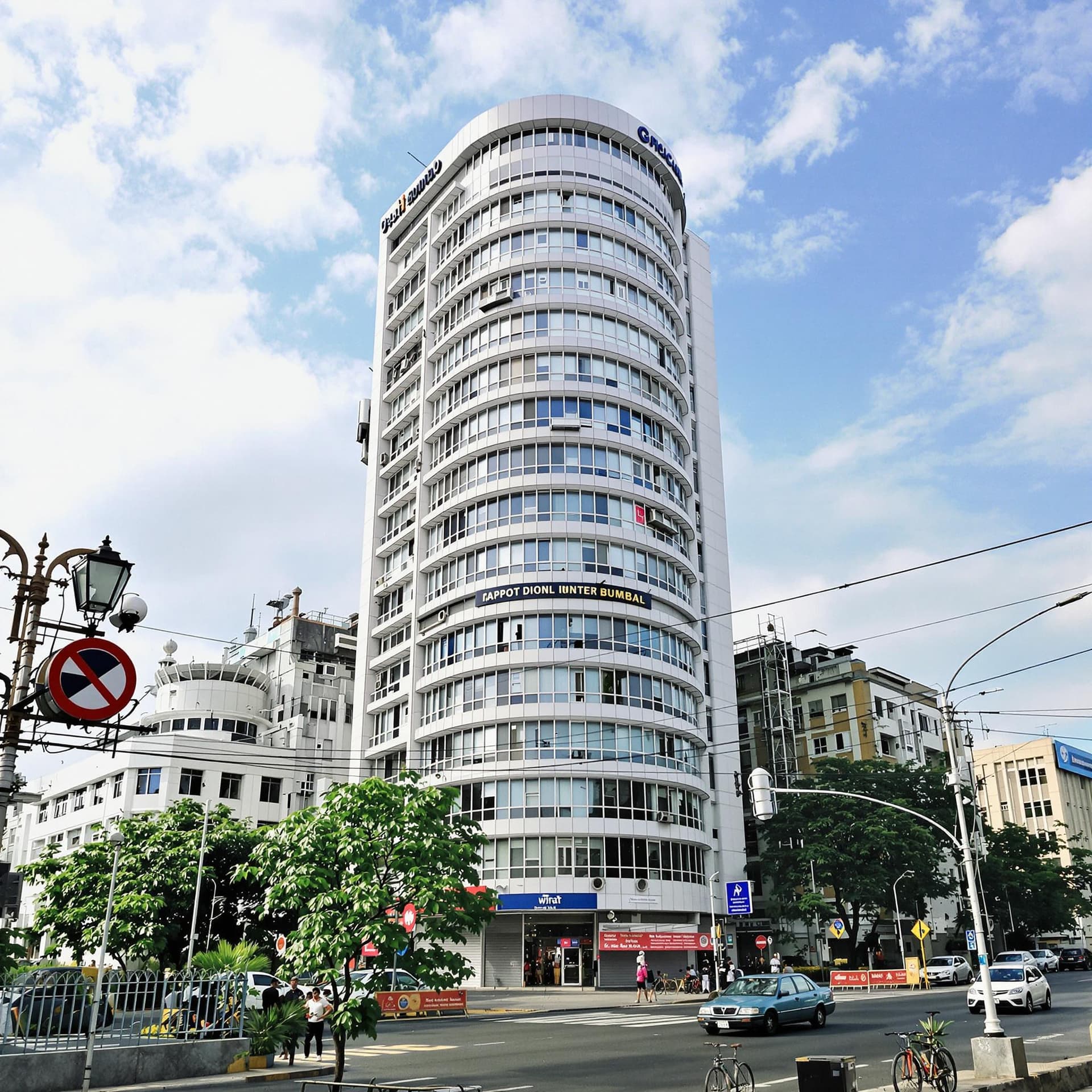 AI generated: From a ground-level perspective, a single office building in Mumbai, India, is centered and very clo...