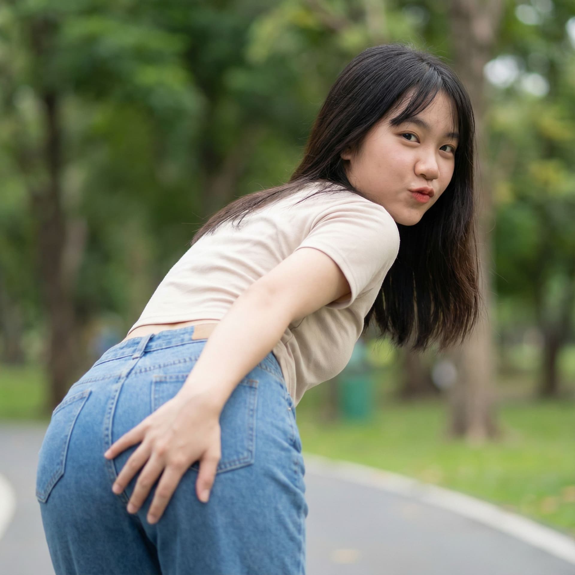 AI generated: an asian teen bend over spreading her ass wide with her own hand, and look backward