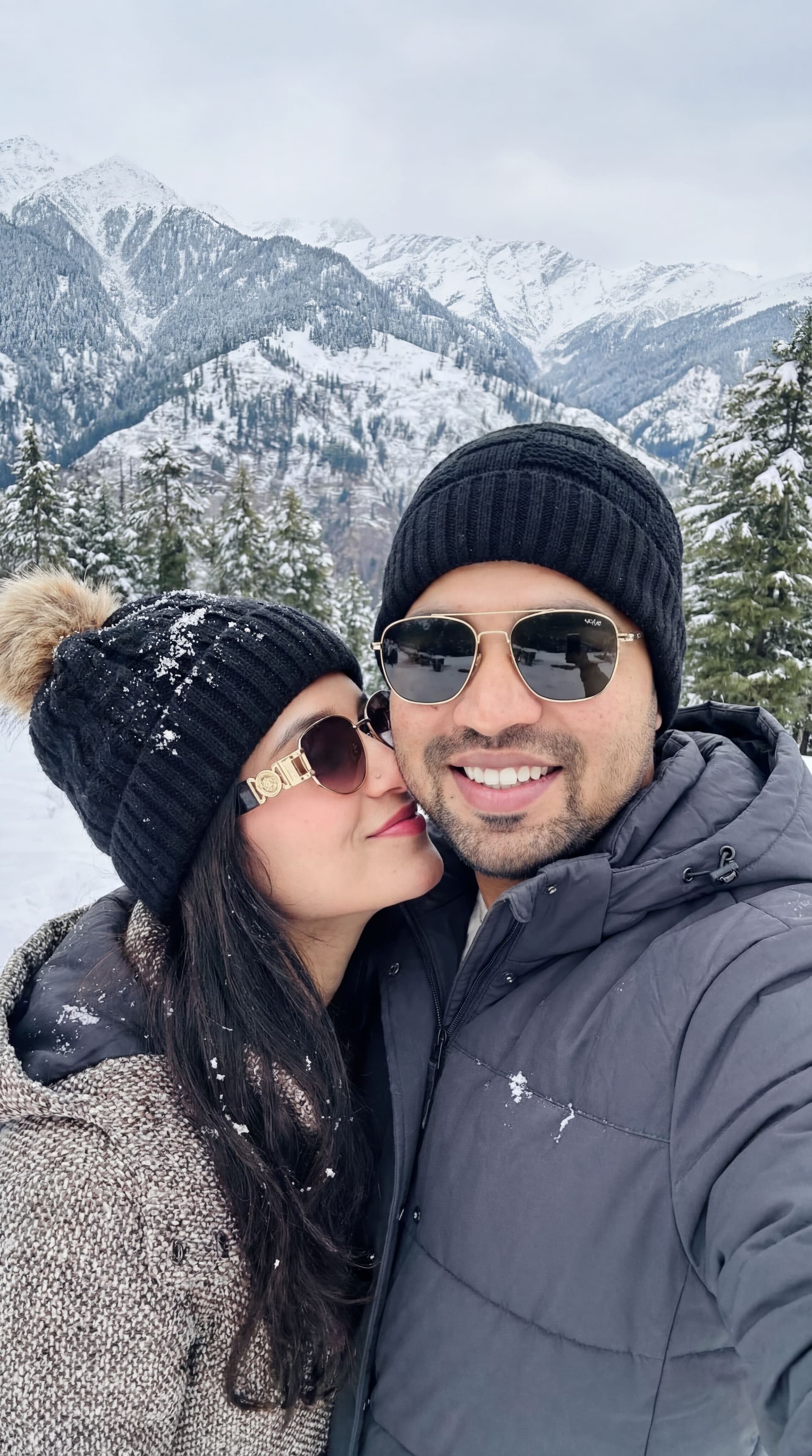 AI generated: 2-A high-quality, realistic winter selfie of a young couple standing very close together in a snowy ...