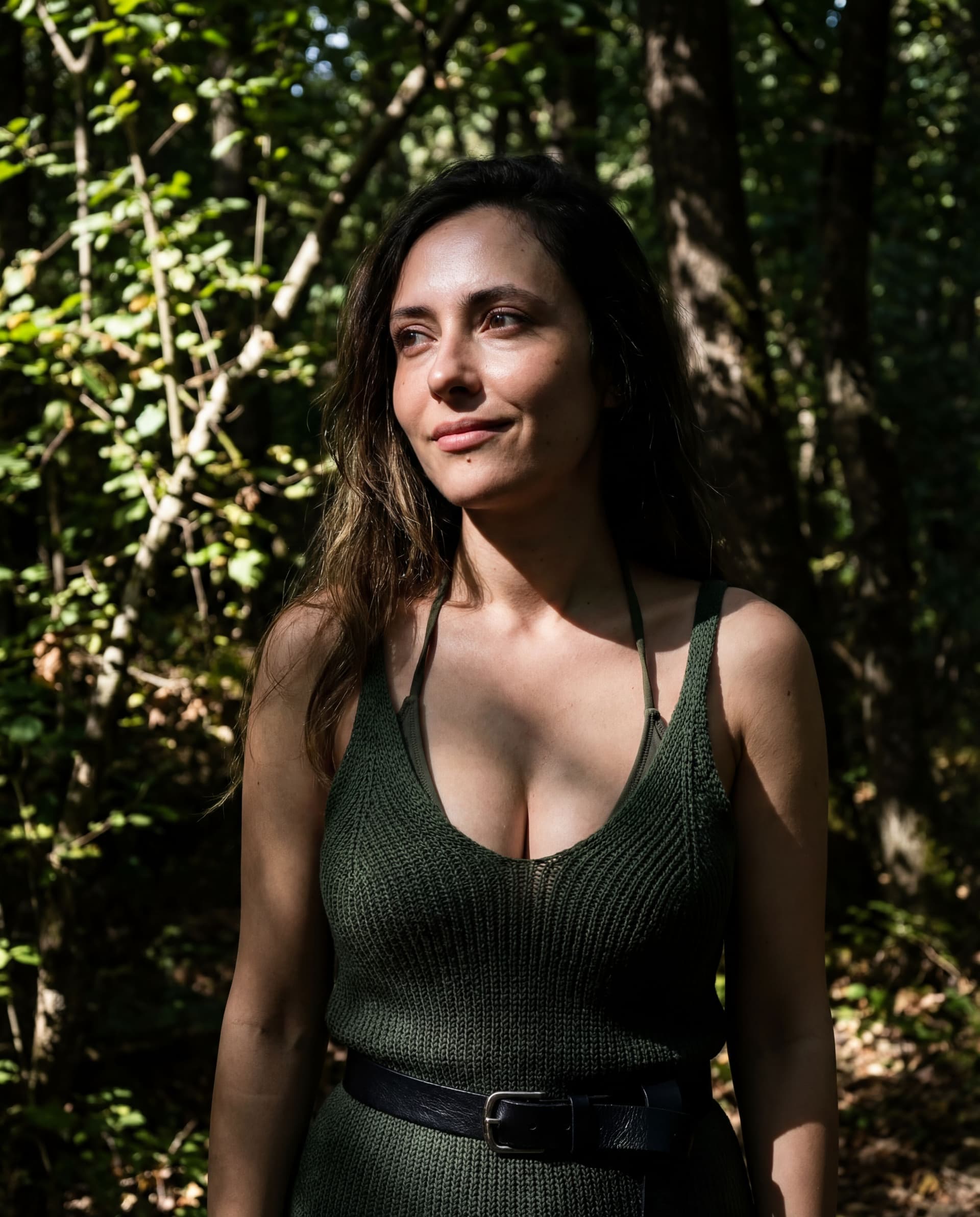 AI generated: Dark shadows and high-contrast cinematic imagery. Wearing a green top. Above average, quite large an...
