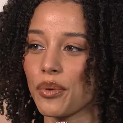 AI generated video: A woman mokes a man for his small size pinching her hand, with her thumb and index