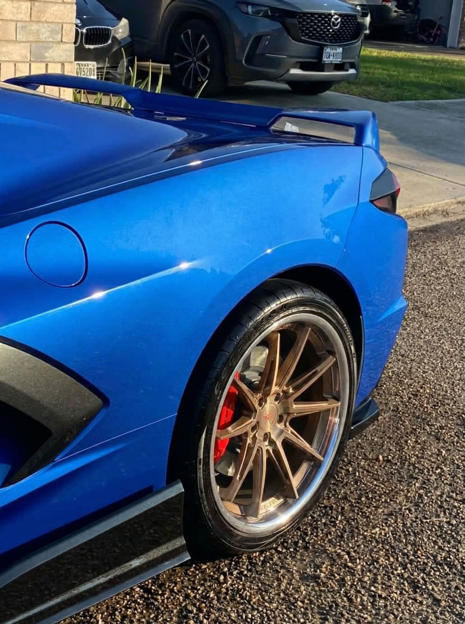 AI generated: Add these wheels to this car 