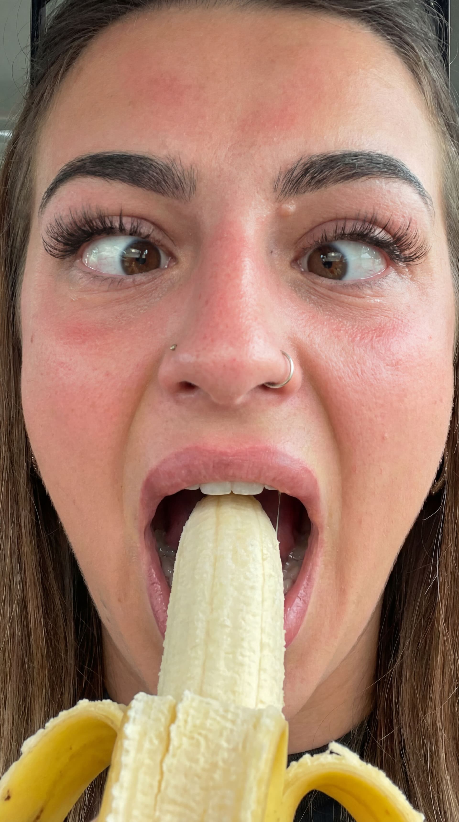 AI generated: Generate a photo of me gagging on a banana at the back of my throat 