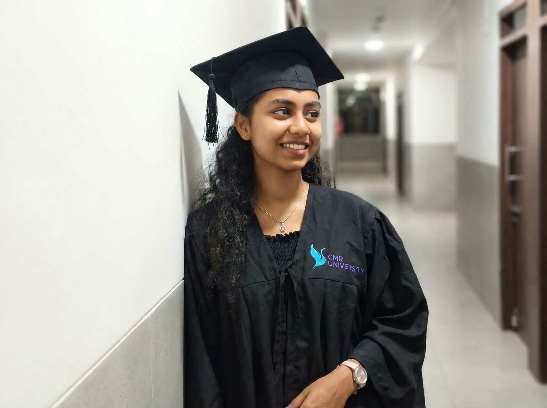 AI generated: Create this image of my graduation day with graduation attire with cmr logo
