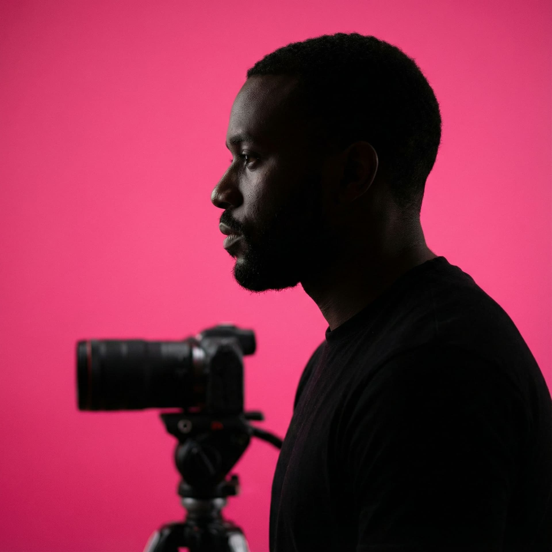 AI generated: photography, portrait of contrast, profile silhouette of a man, vibrant hot pink backdrop, visualize...