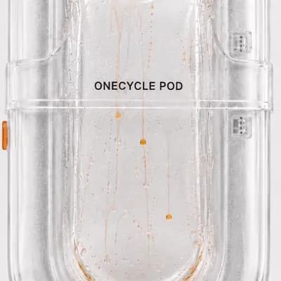 AI generated video: Animate only the orange roplets inside the transparent ONECYCLE POD. Keep the pod, label, digital ti...