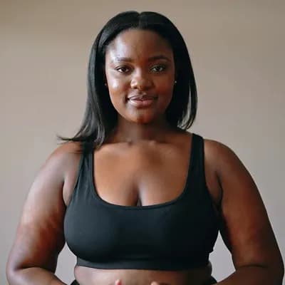 AI generated video: Big-breasted,  dark-skinned African woman, bouncing her ample breasts up and down while smiling and ...