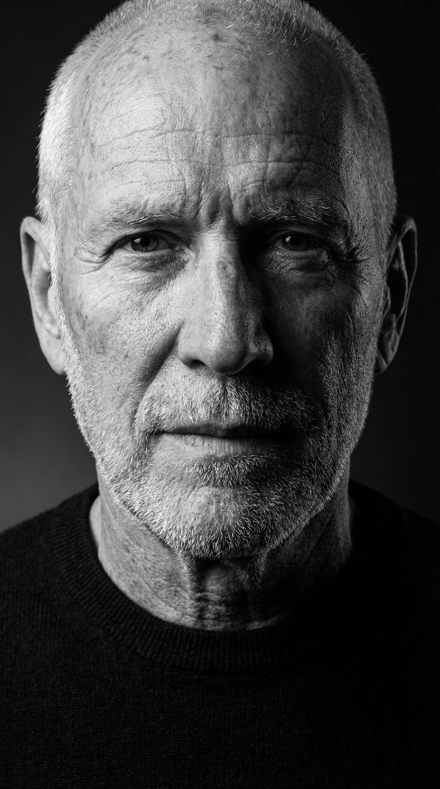 AI generated: High-definition black and white portrait of an attractive mature man, 60–80 years old. Minimalist be...