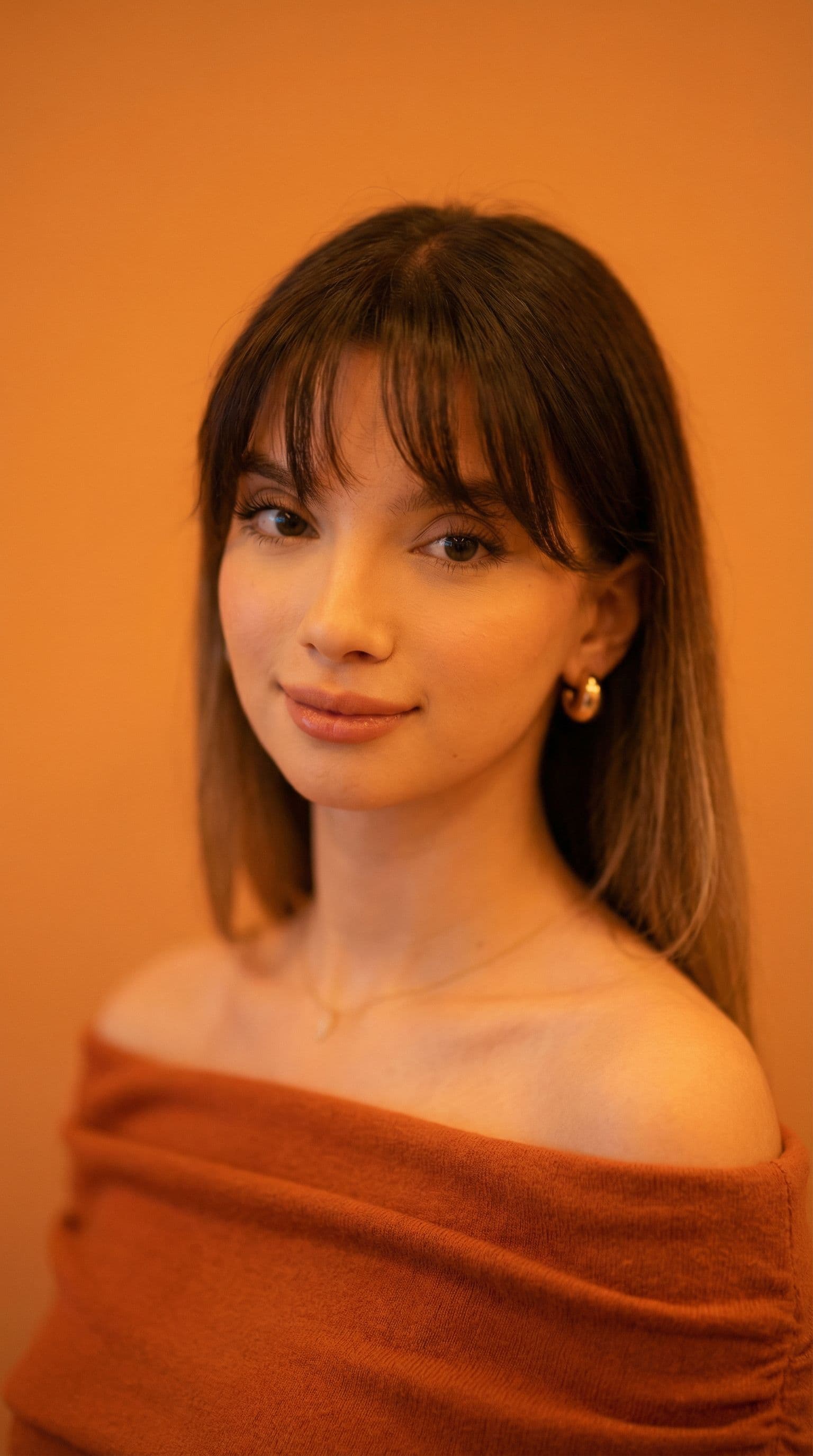 AI generated: photography, orange hue, korean woman model, solid orange backdrop, using a camera setup that mimics...