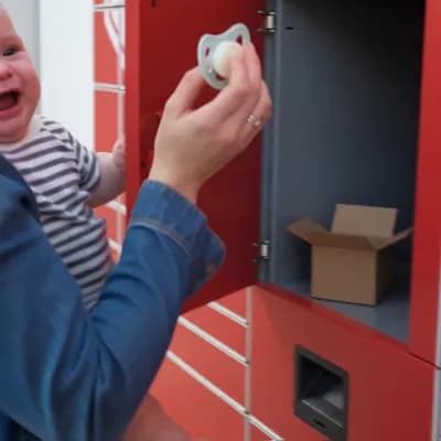 AI generated video: An intimate, shallow-focus close-up shot. A mother's gentle hand brings a clean, white pacifier to h...