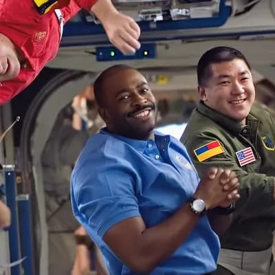 AI generated video: Inside the main module of the International Space Station, three astronauts float in microgravity wi...