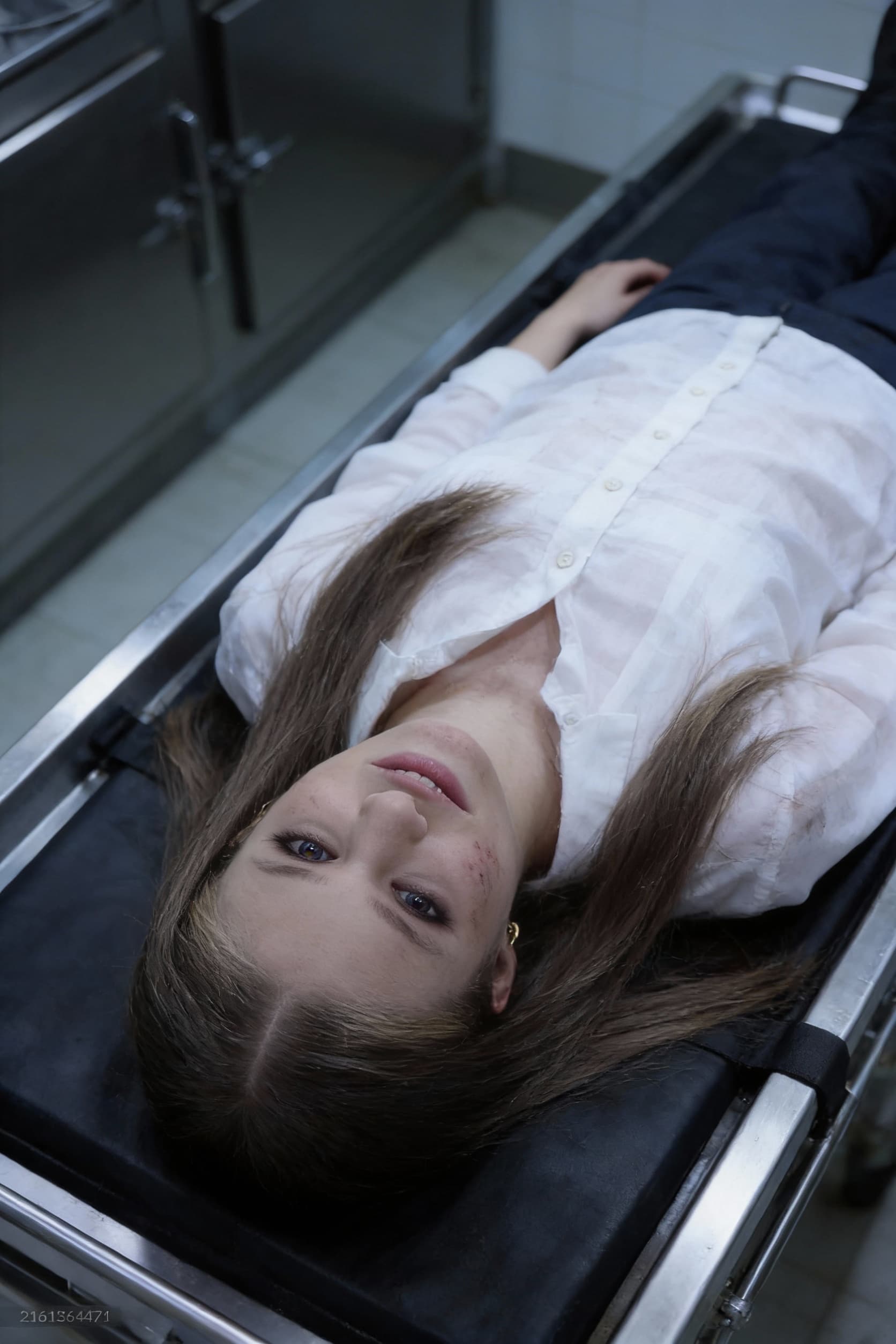 AI generated: dead girl lying in morgue, death stare. top view