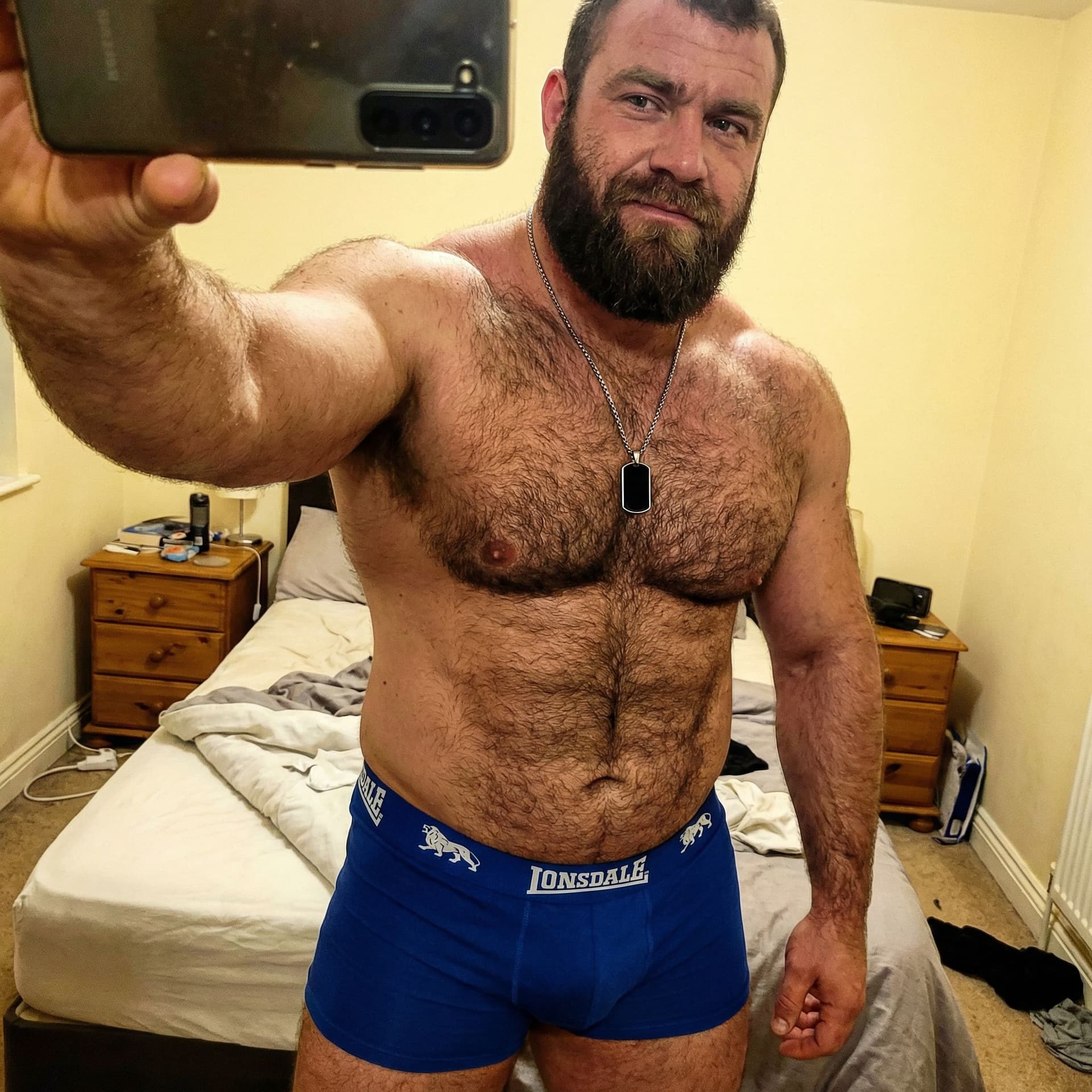 AI generated: Raw candid unposed smartphone selfie of a rugged 30-year-old white man, extremely muscular and thick...