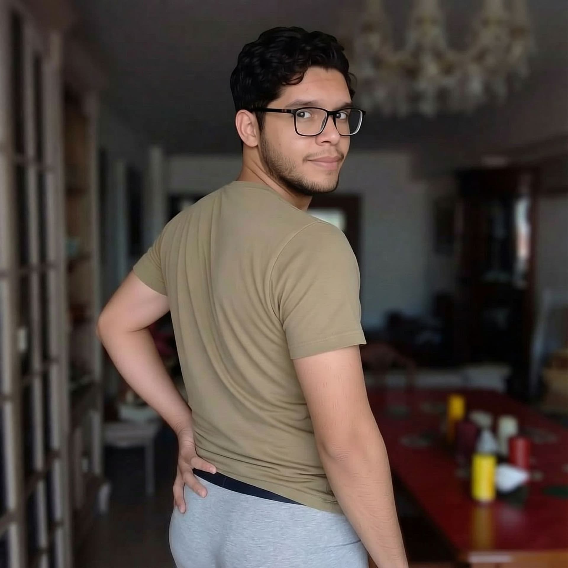AI generated: remove their pants, to reveal his round butt