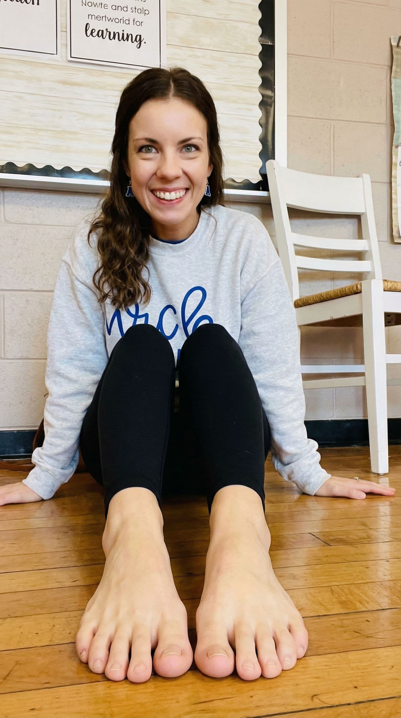 AI generated: Have this girl sitting down with her bare feet out in front of her and give her long toes