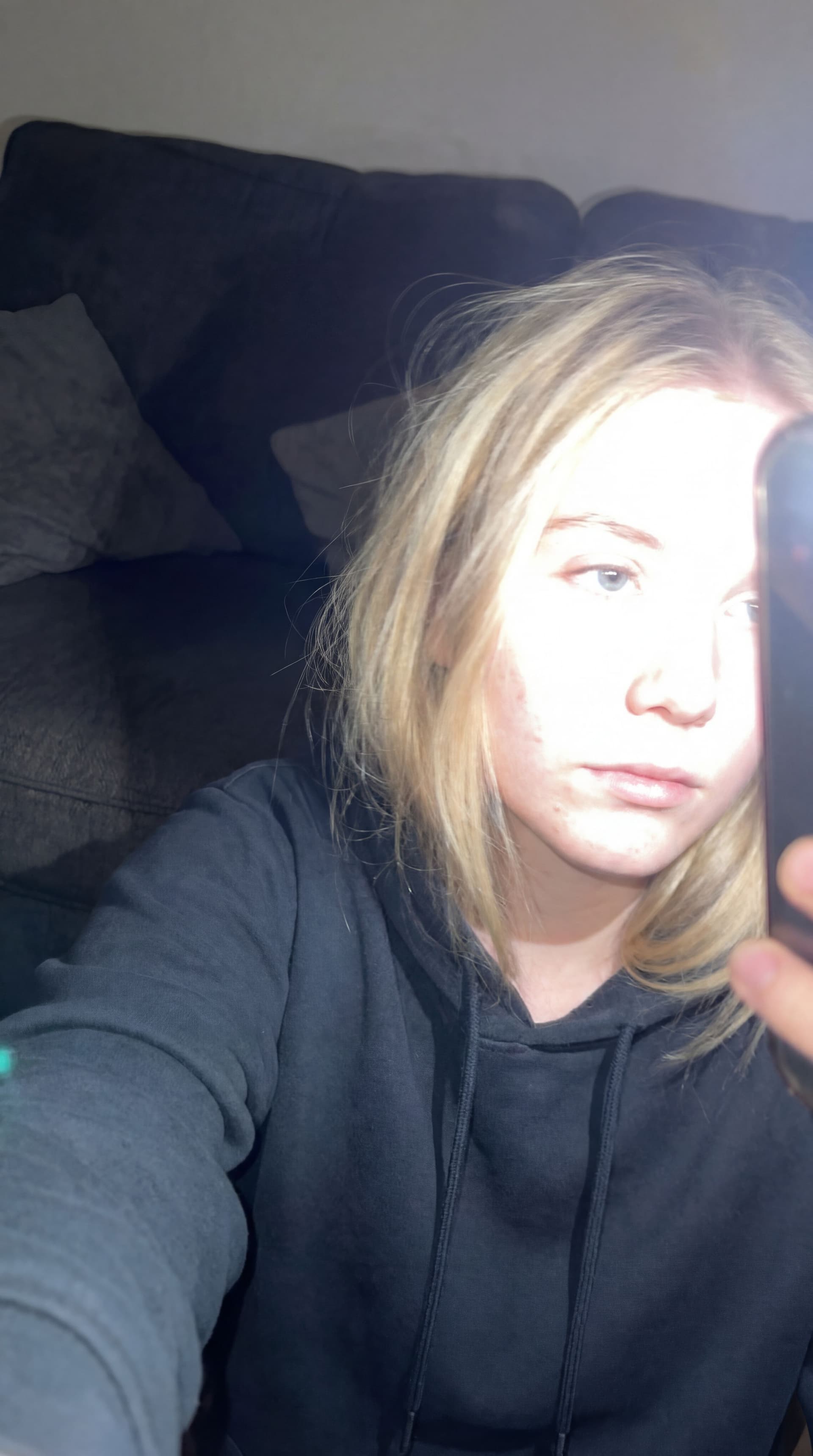 AI generated: Using the uploaded reference photo, create a standard iPhone selfie with flash. There's no clear sub...