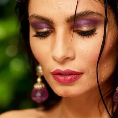 AI generated video: Beautiful model with a sultry look, her eyes look down, as she faces turns to look directly at camer...