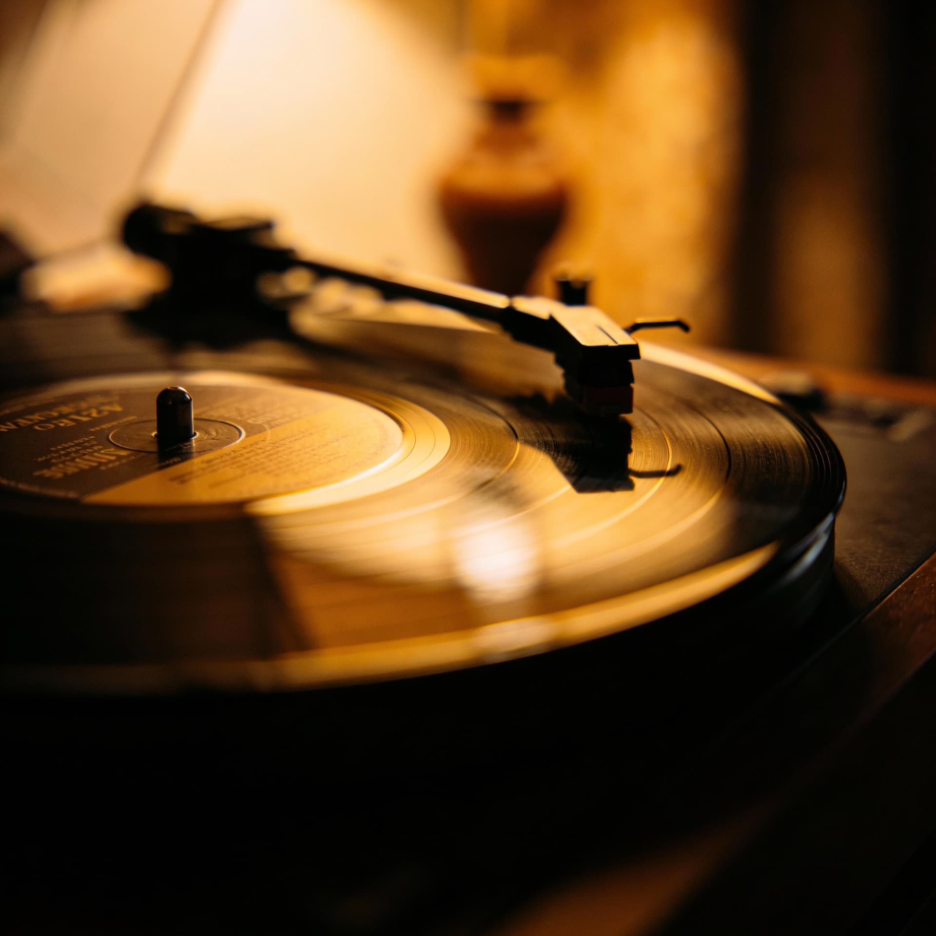 AI generated: Vintage vinyl record spinning slowly in a dark room, soft warm light, emotional nostalgia, cinematic...