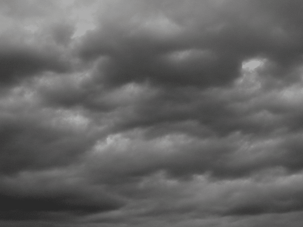 AI generated: full sky of flat simple texture cartoonish multiple flat stormy clouds in greyscale low quality smal...